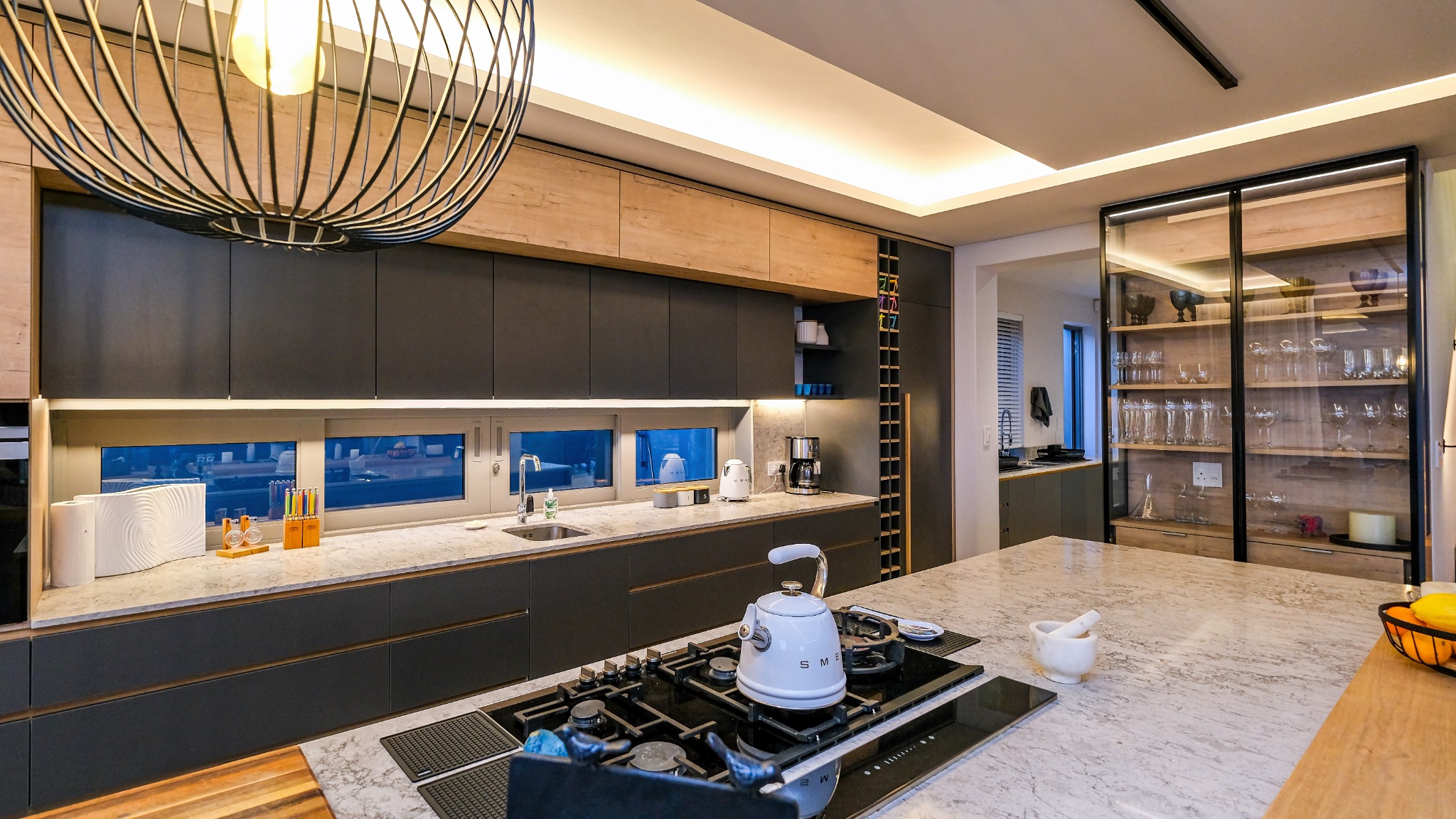 Contemporary kitchen with island and pendant lights
